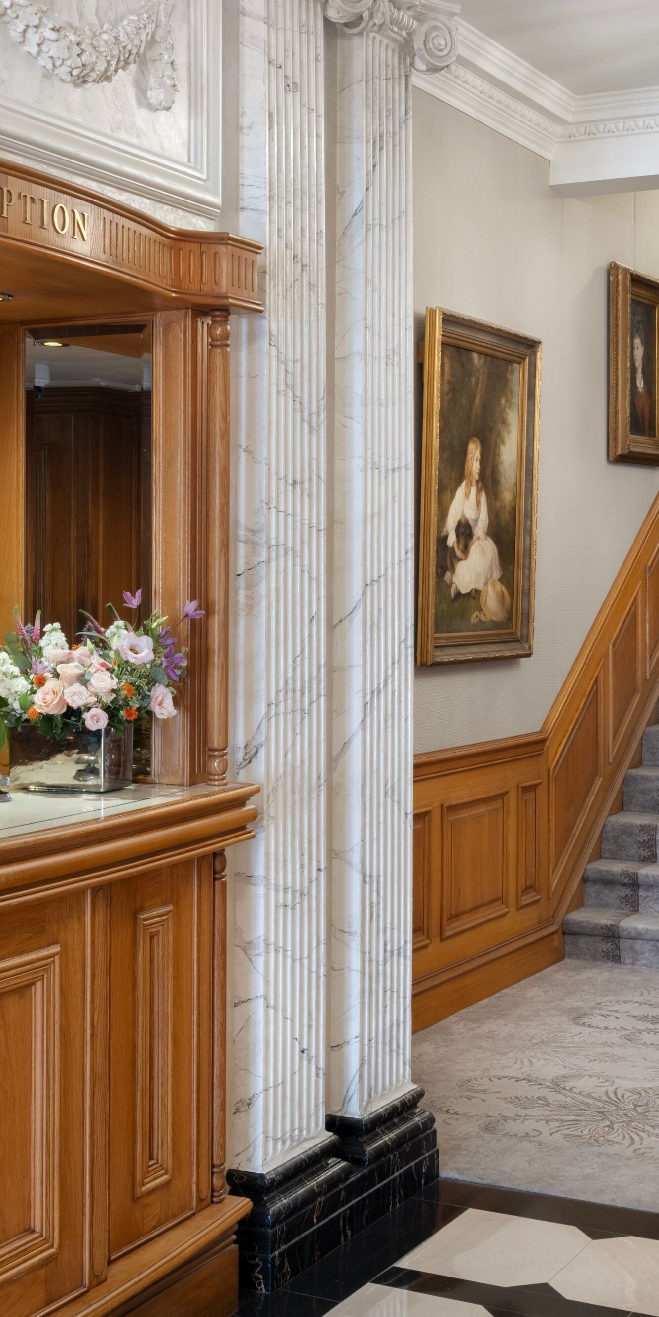 Lobby with front desk and staircase