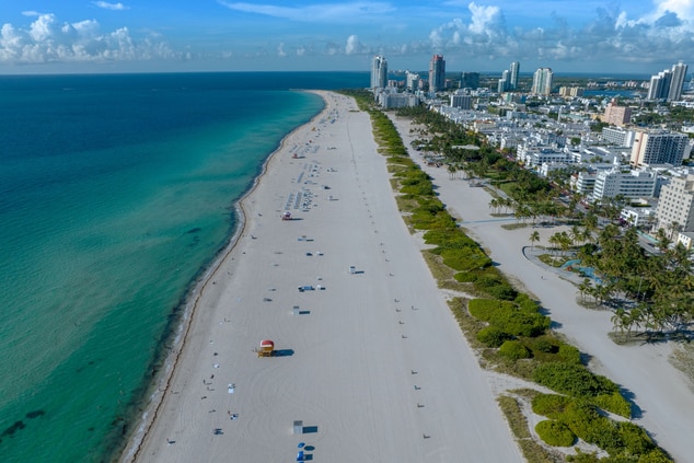 Aerial view of beach and city skyline