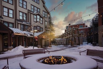 Snow-covered firepit and seating