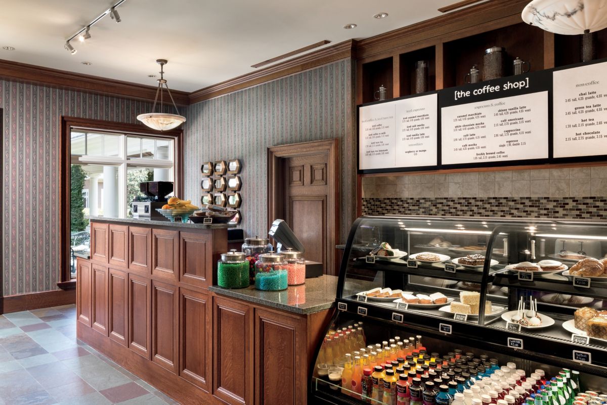 Counter-serve café with case of bottled beverages and pastries