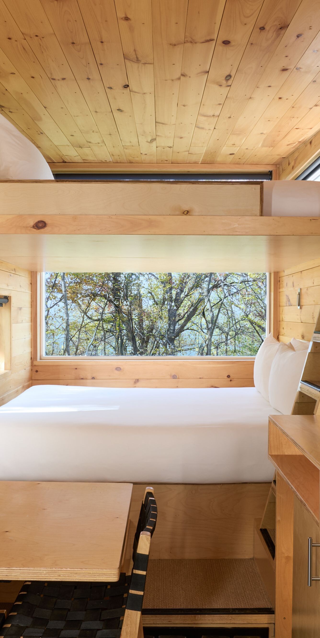 Bunk cabin view with kitchenette, dining table