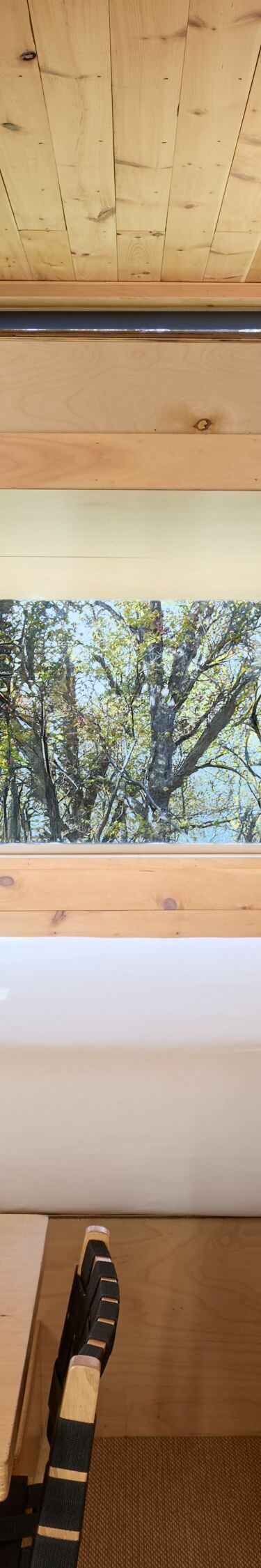 Bunk cabin view with kitchenette, dining table