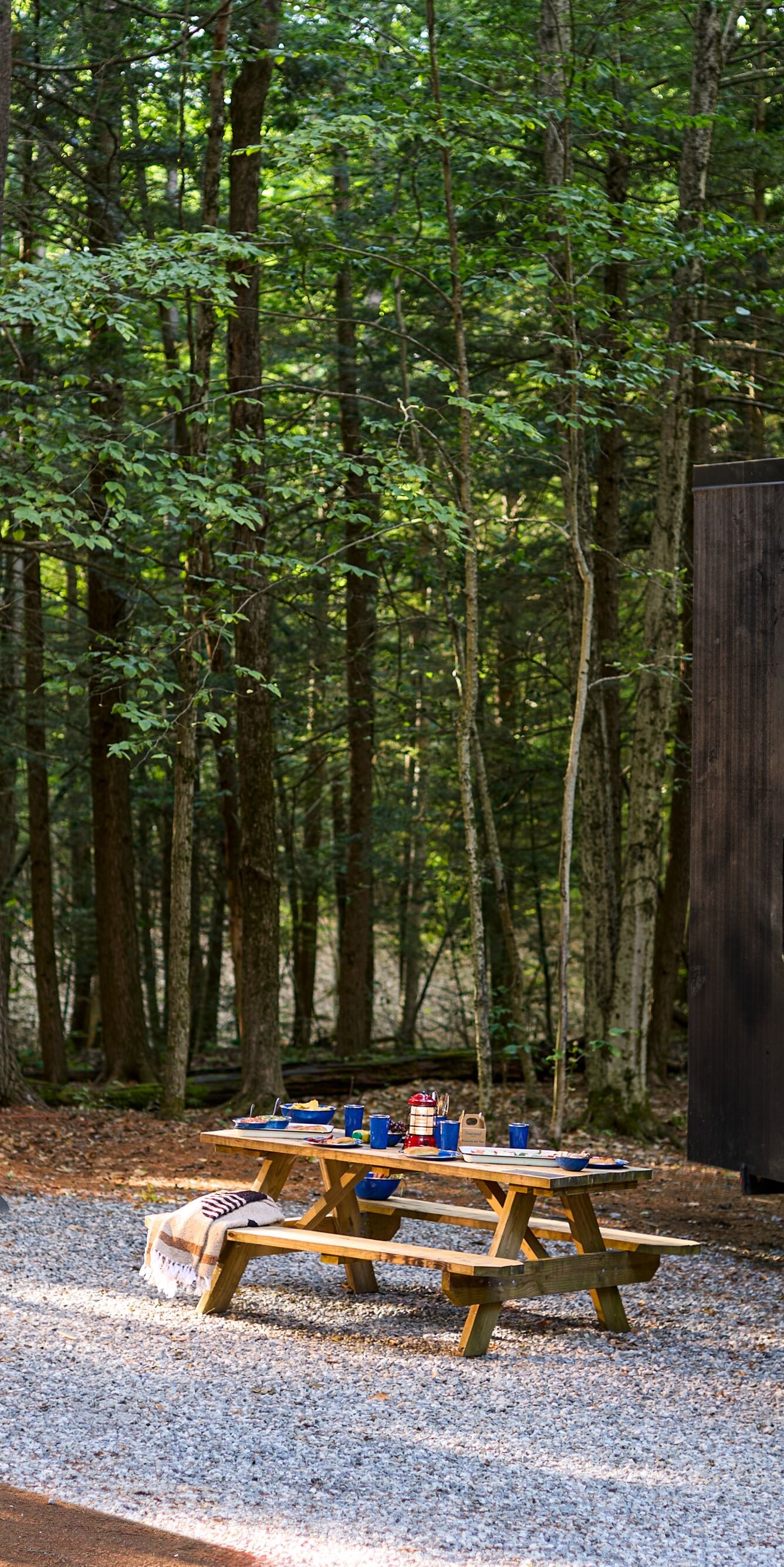 Cabin Exterior with Fire Pit and AdirondackChairs