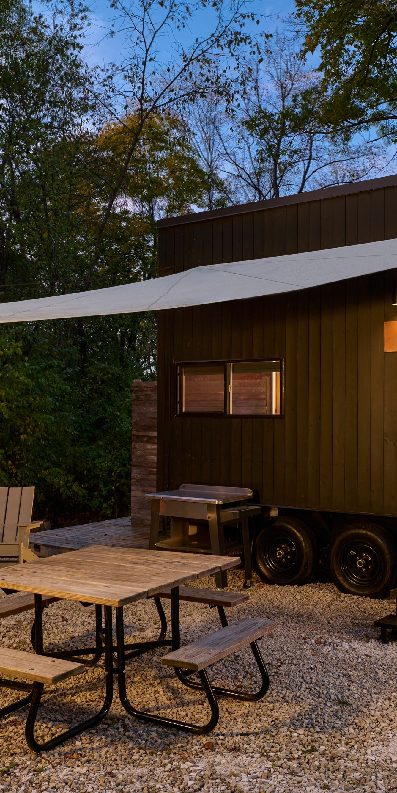 cabin exterior with fire pit and picnic table