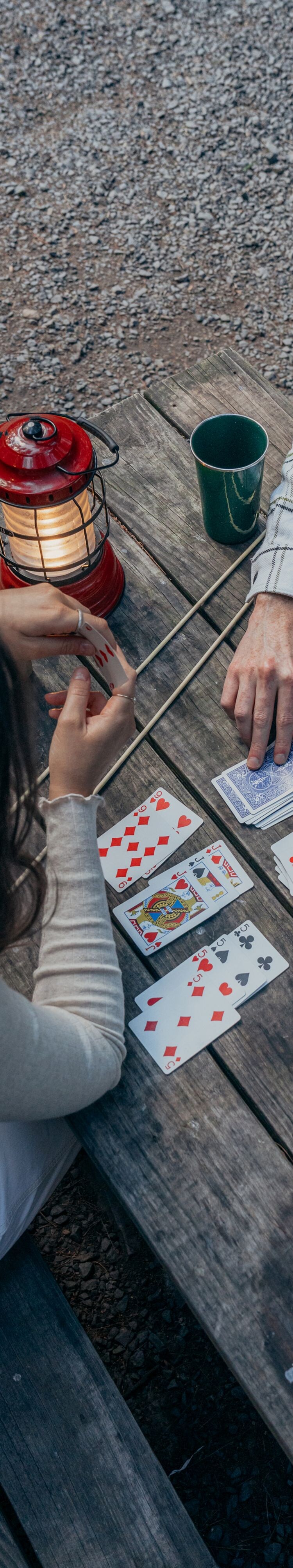 Couple playing games outside cabin