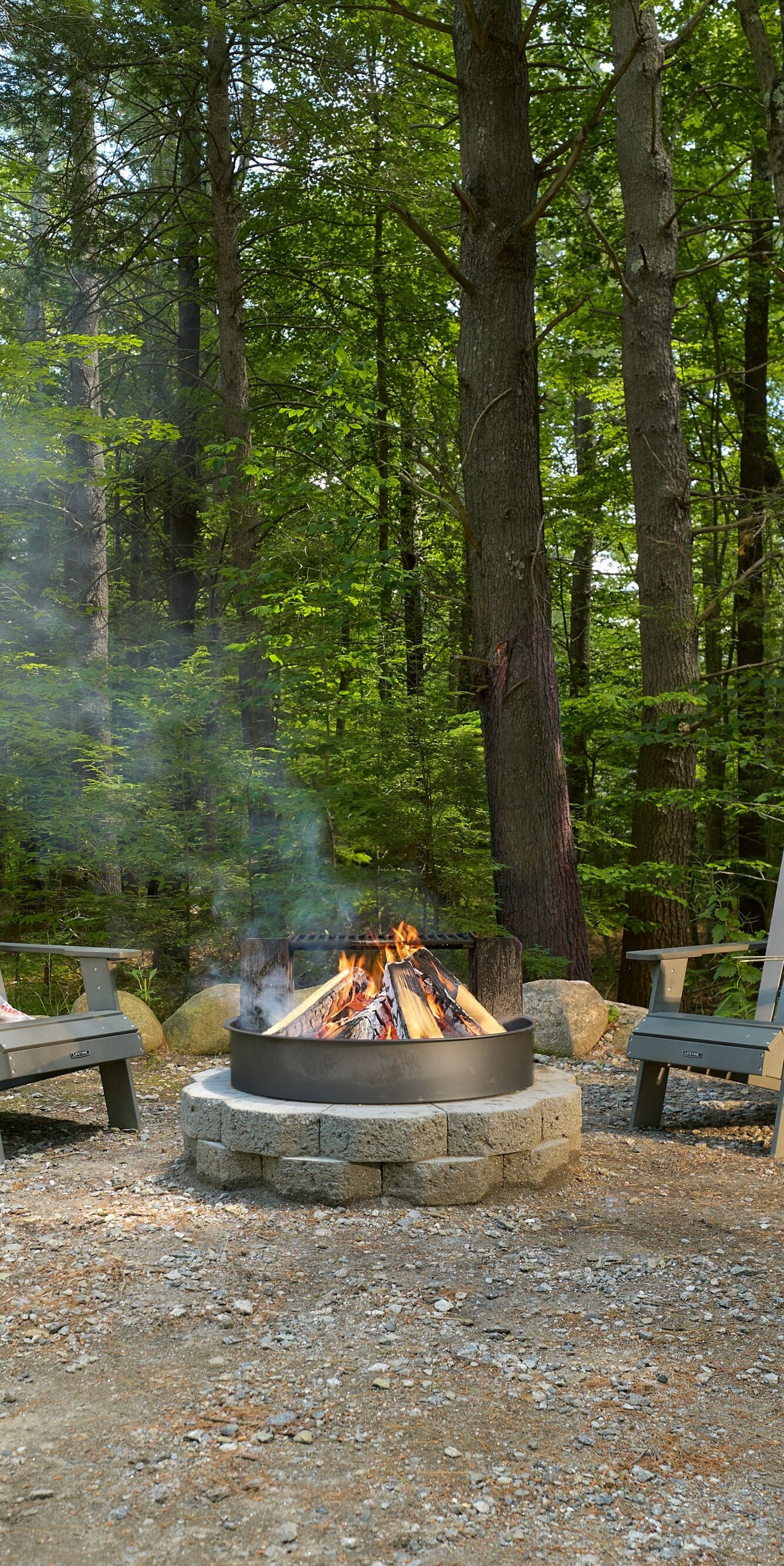 Firepit and Adirondack Chairs in Woods