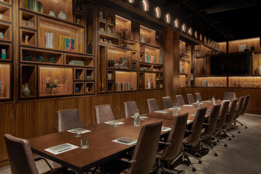 Floor-to-ceiling walnut panels in a meeting boardr