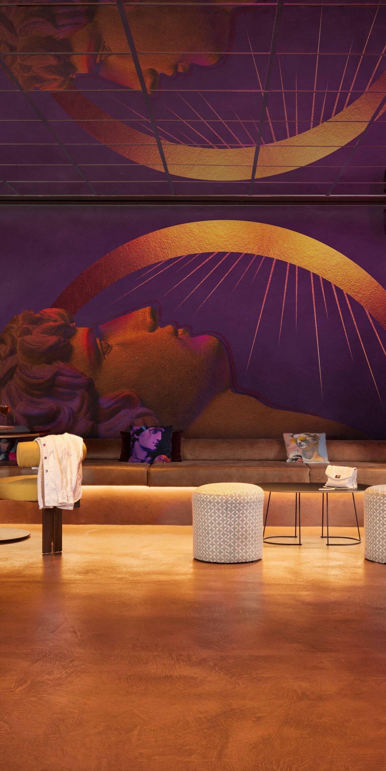Self check in desks in lounge area with sofas 