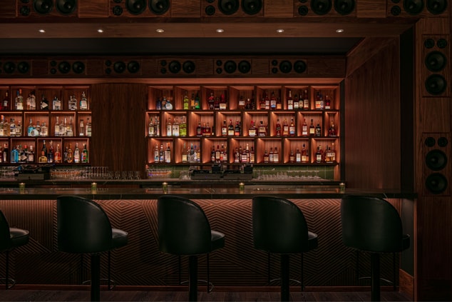 Close up of the bar and seating with stereos  