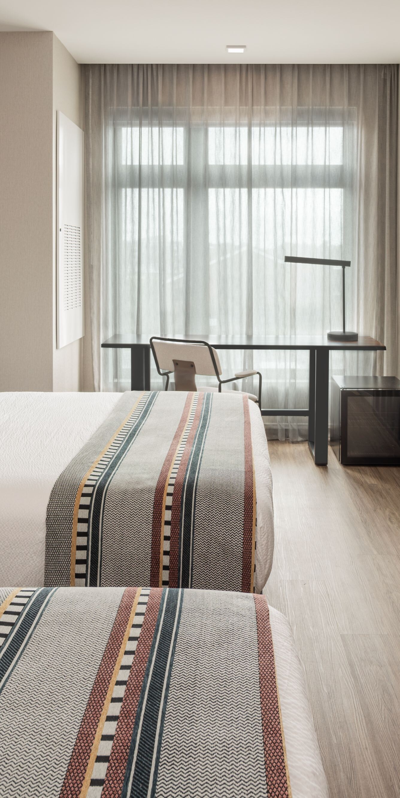Two queen beds and workspace