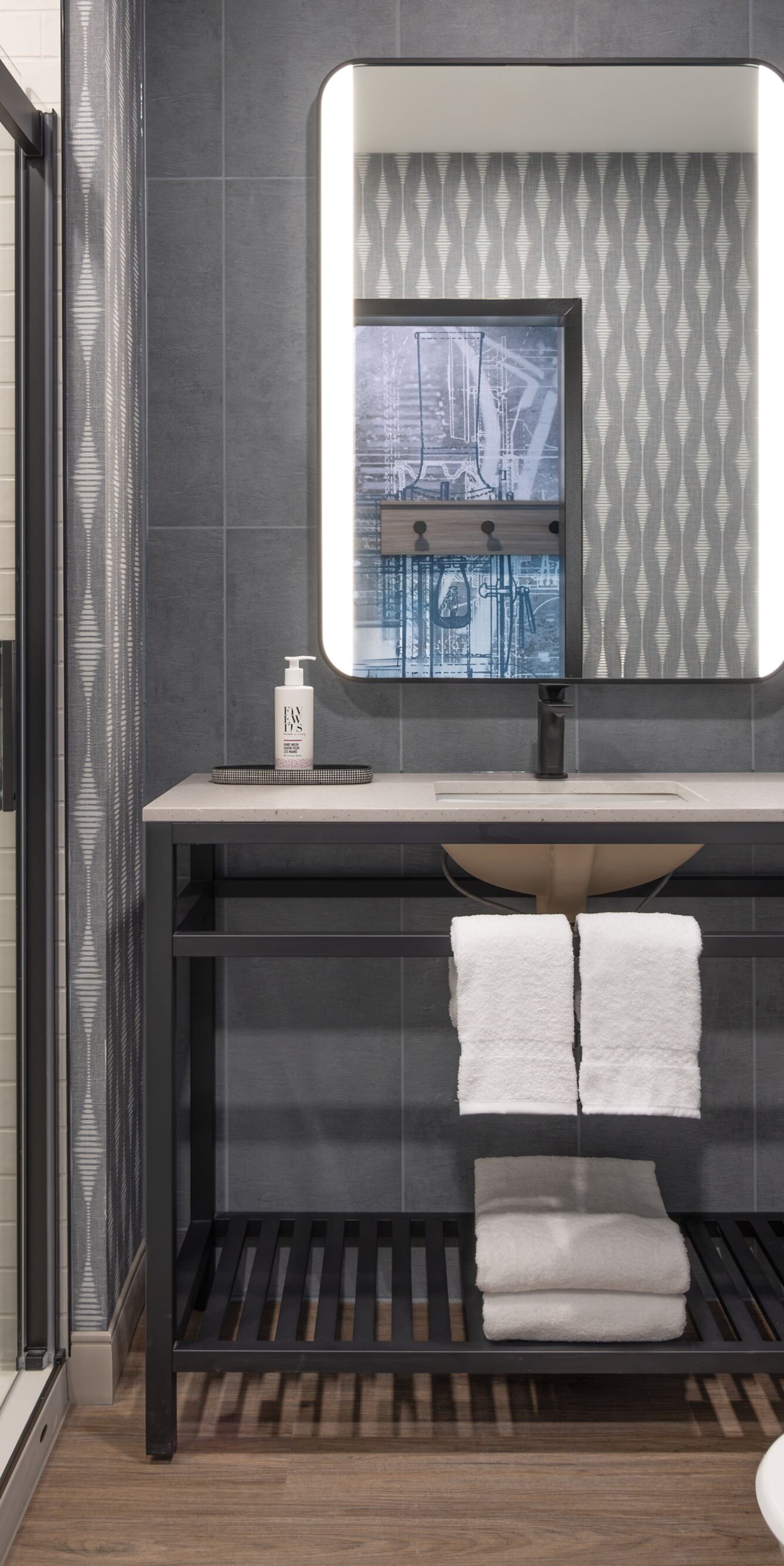 Bathroom with vanity and shower.