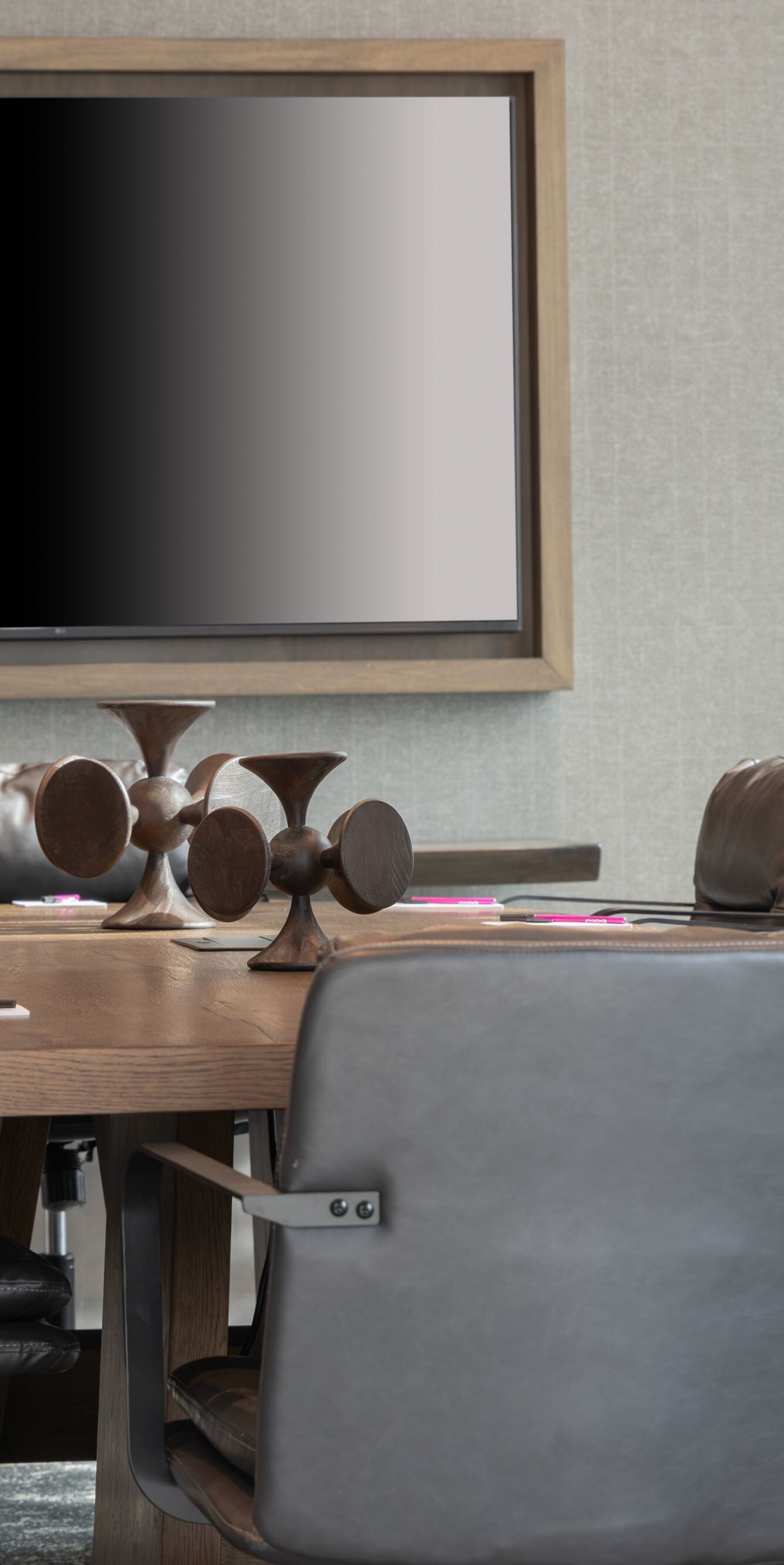 Boardroom table and large television on wall