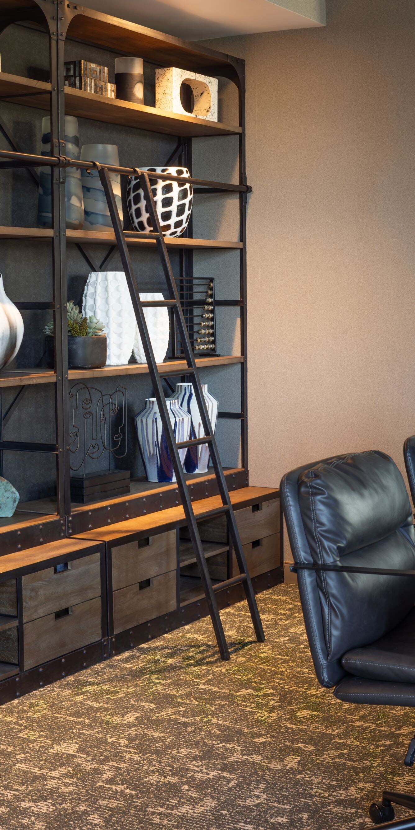 Wall of shelving decor in meeting room