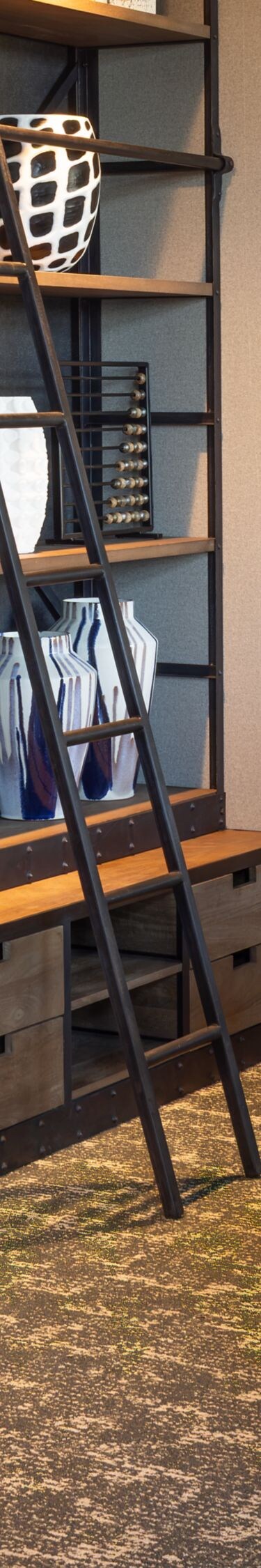 Wall of shelving decor in meeting room