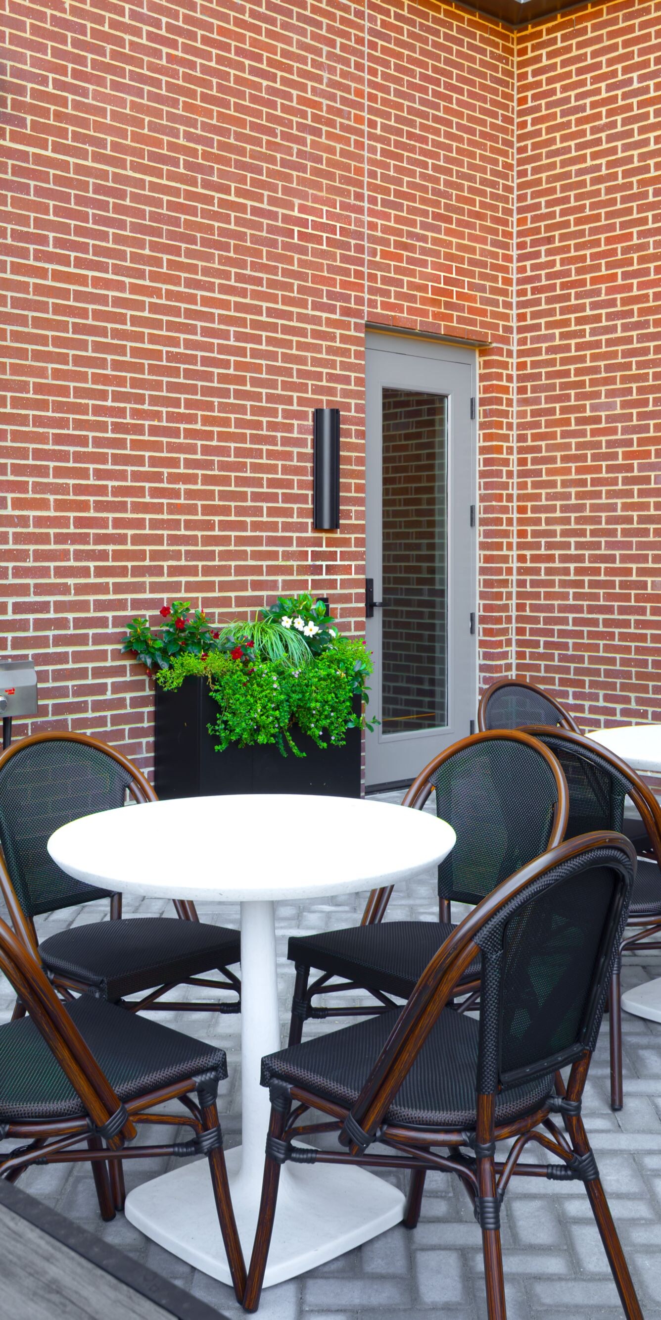 Patio with seating and grill