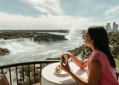A woman on patio overlooking Niagara Falls