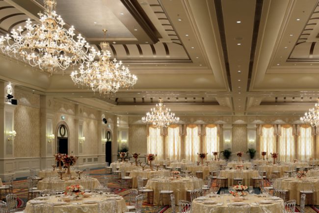Spectacular wedding reception in shades of cream held within a grand ballroom