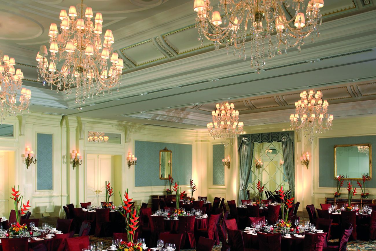 Ballroom with chandeliers and banquet tables