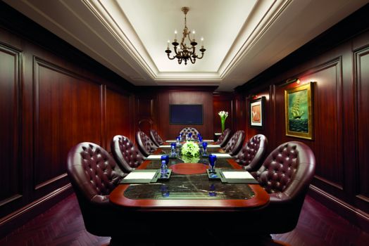 Long wood meeting table with leather chairs