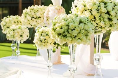Flower arrangements on a table outside