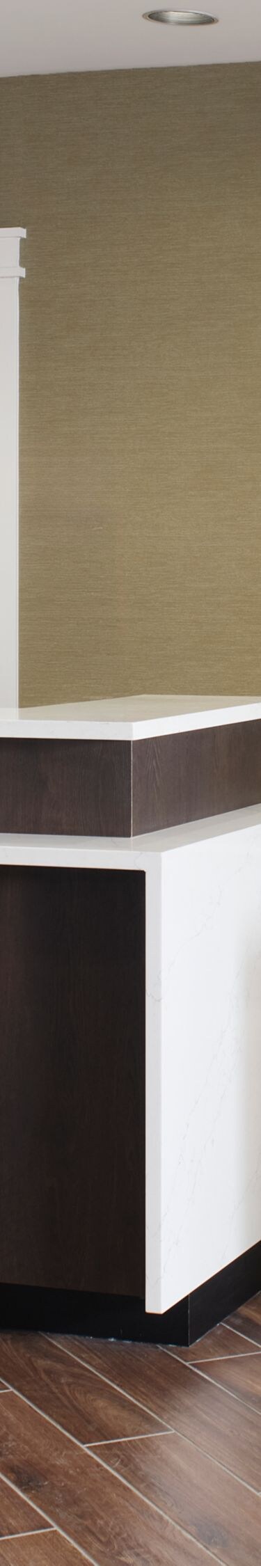 Hotel front desk with wood counters and tile floor