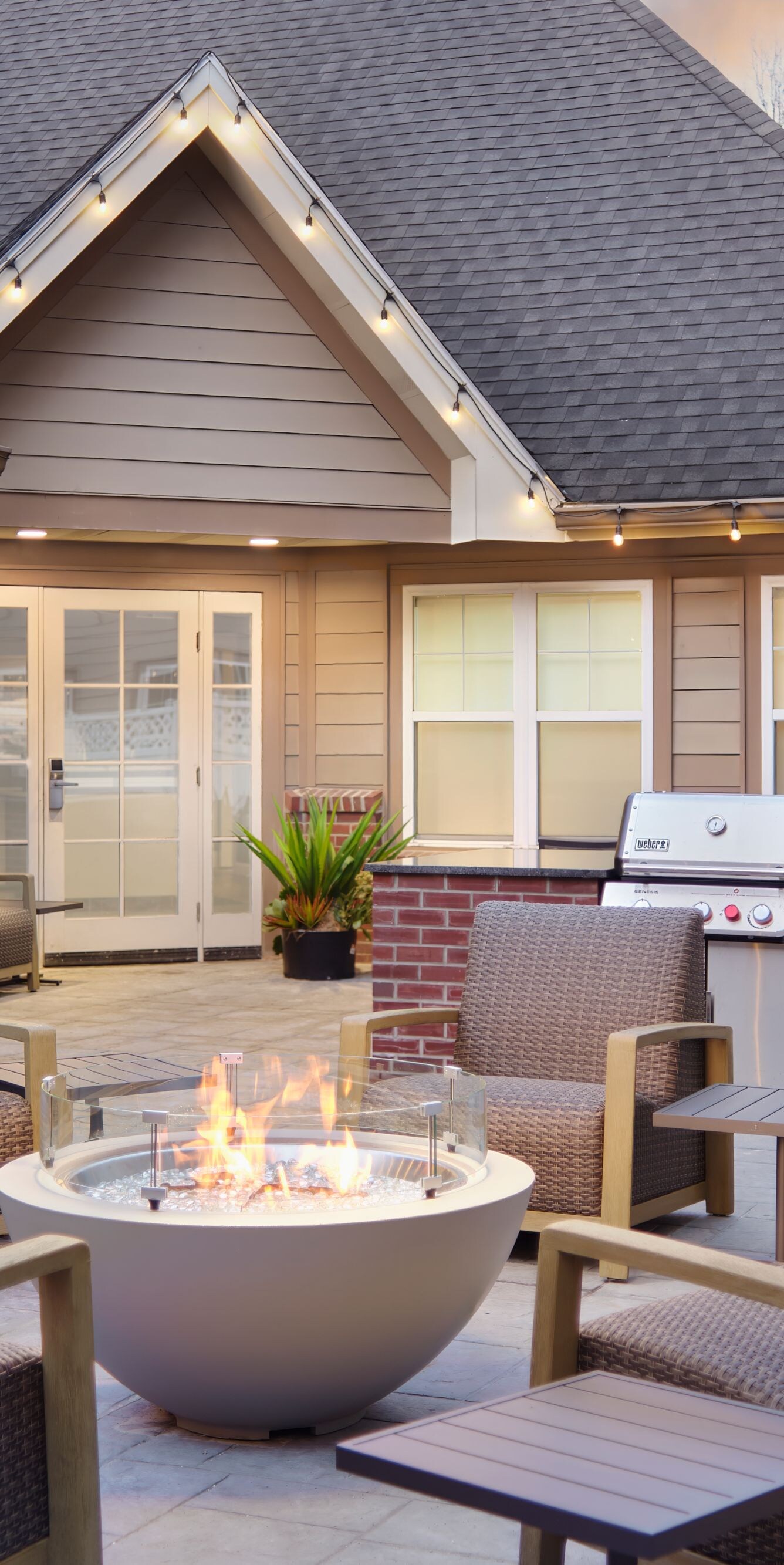 Outdoor Courtyard with a grill and a fire pit