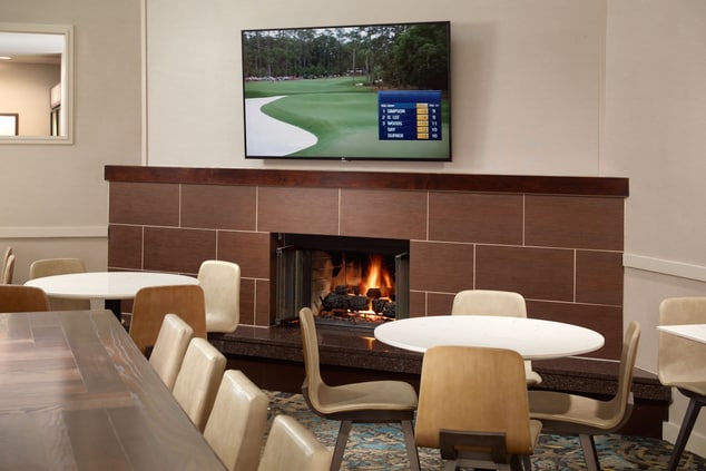 lobby seating area with tv & fireplace