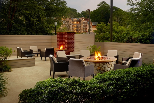 An outdoor area with seating and firepits