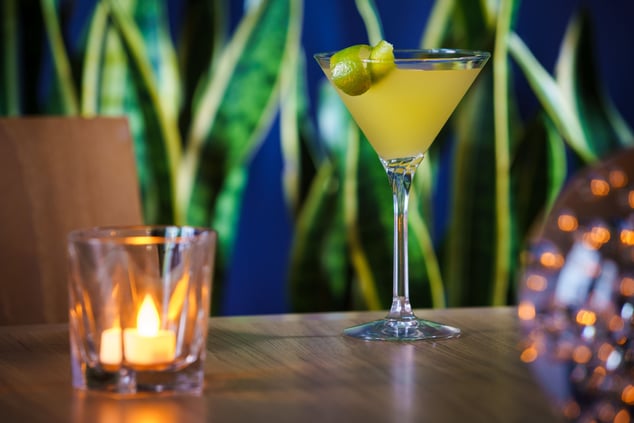 Yellow cocktail in a martini glass 