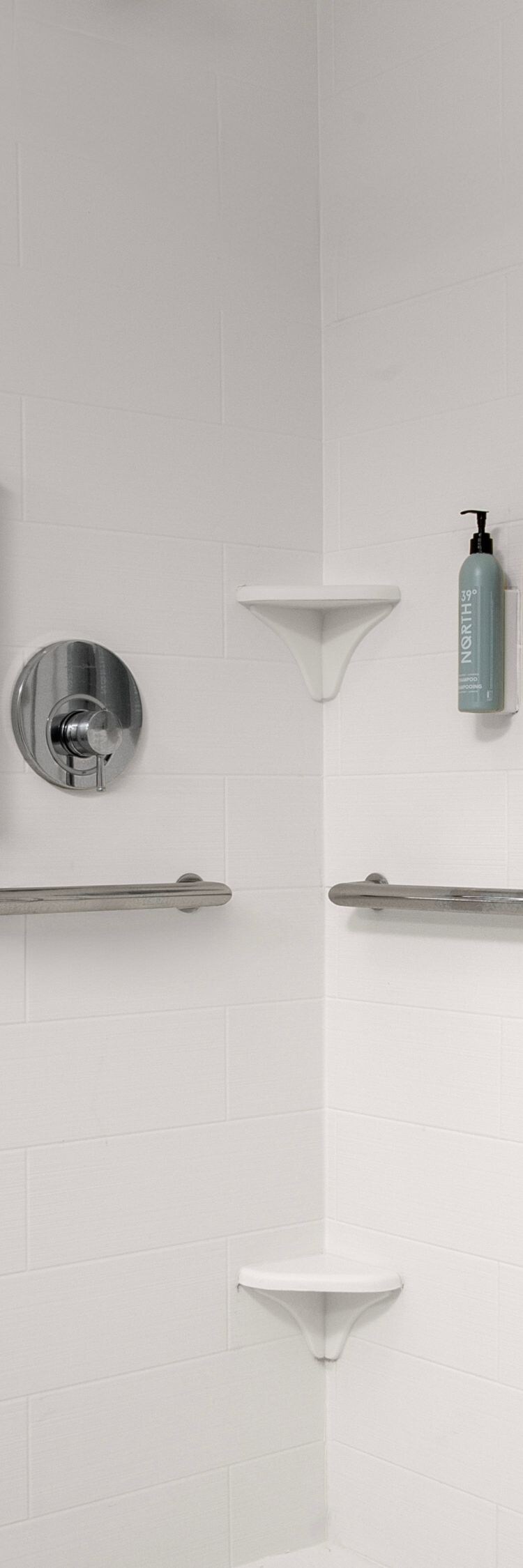 roll-in shower with seat and grab bars