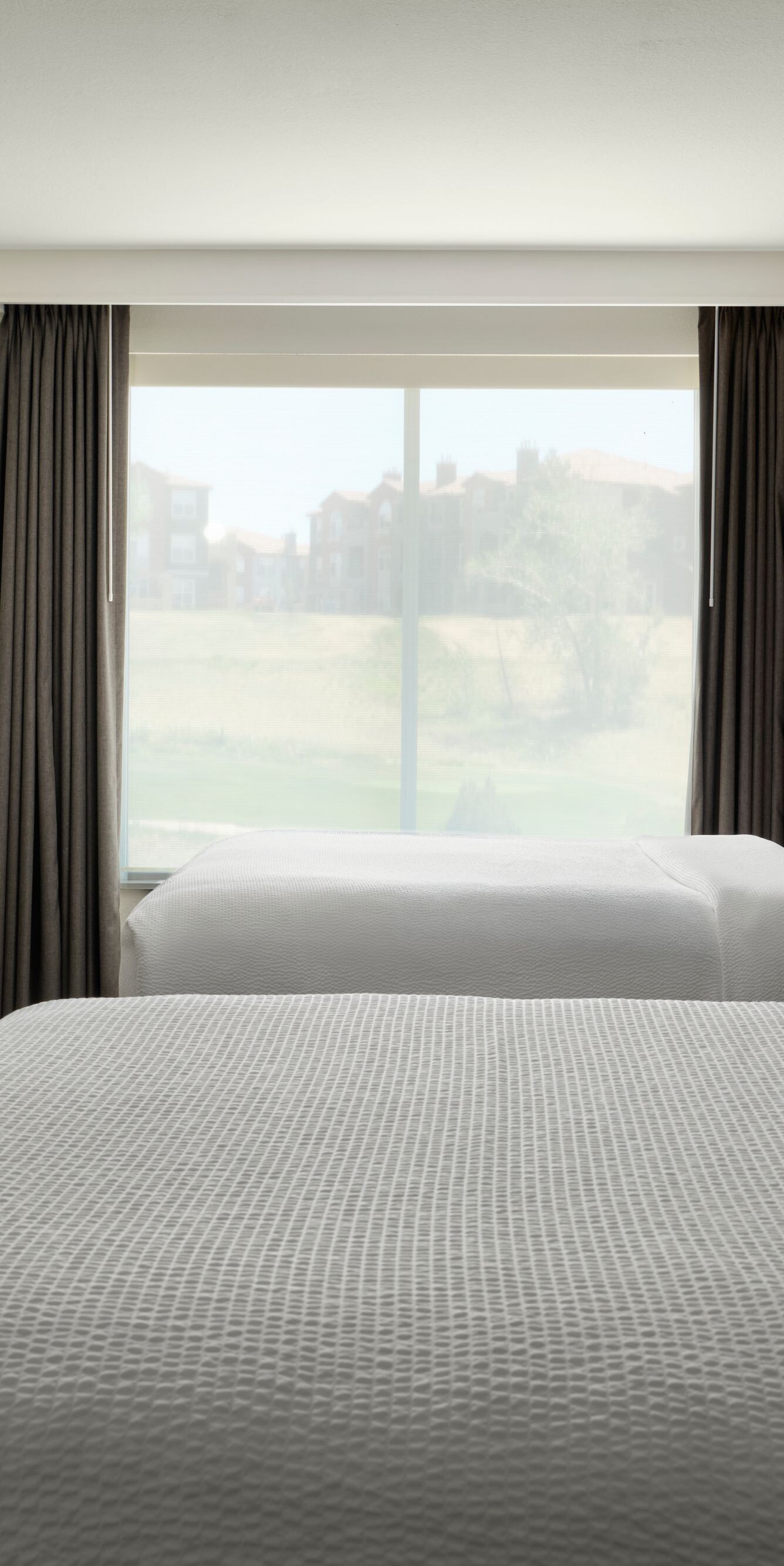 Two queen bed hotel suite bedroom