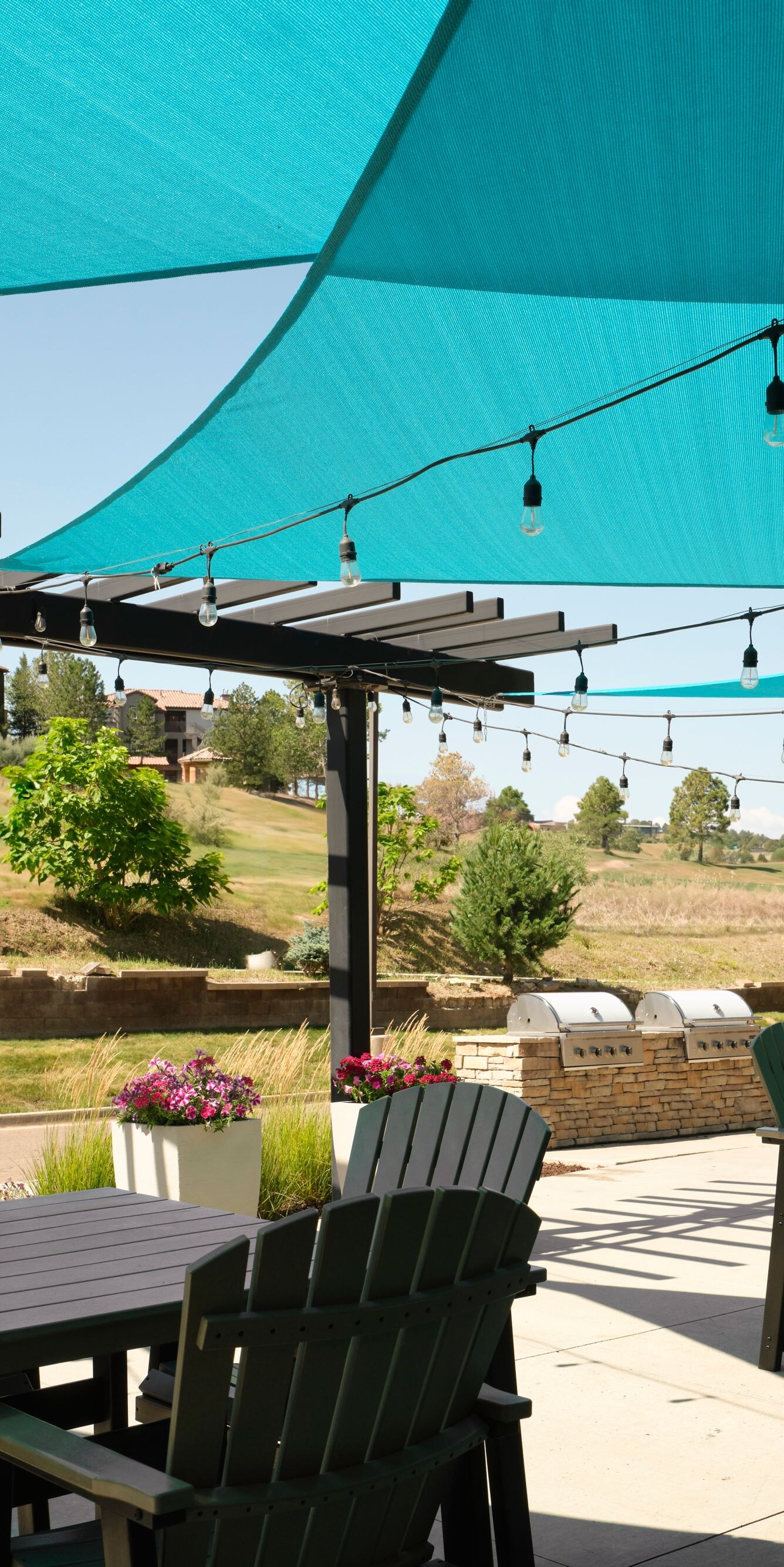 Covered outdoor patio with tables and chairs