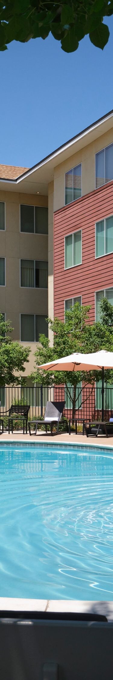 Pool with lounge chairs and umbrellas