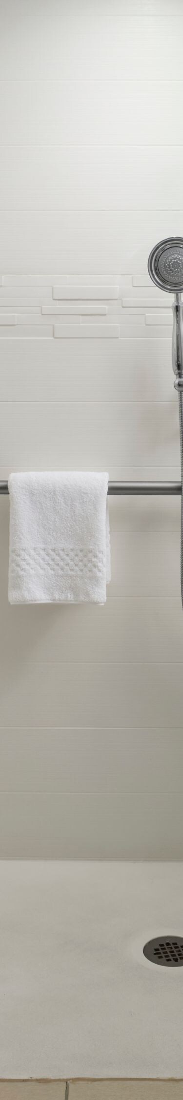 Accessible roll-in shower with grab bars