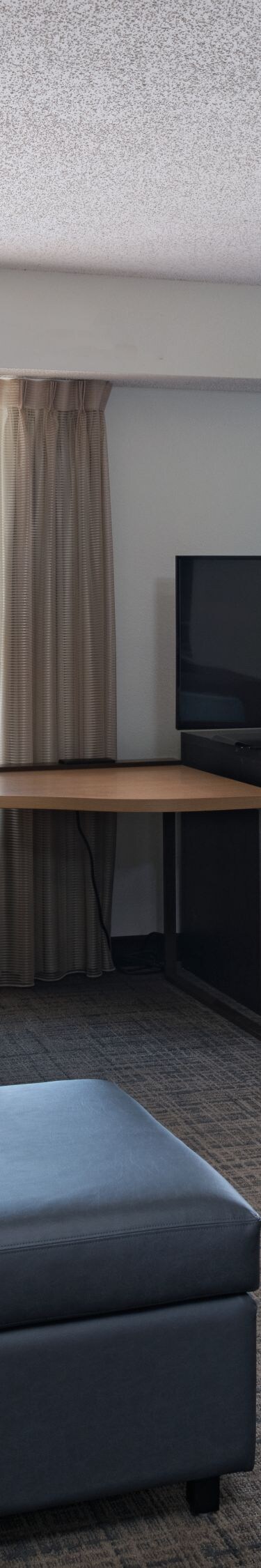 King studio suite living area and work desk