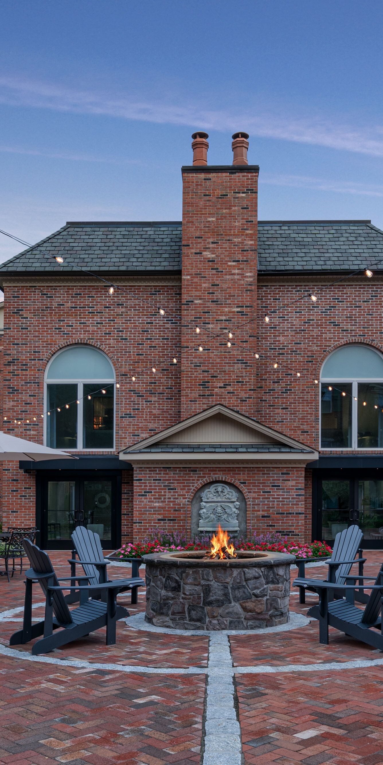Outdoor courtyard with fire pit and seating area