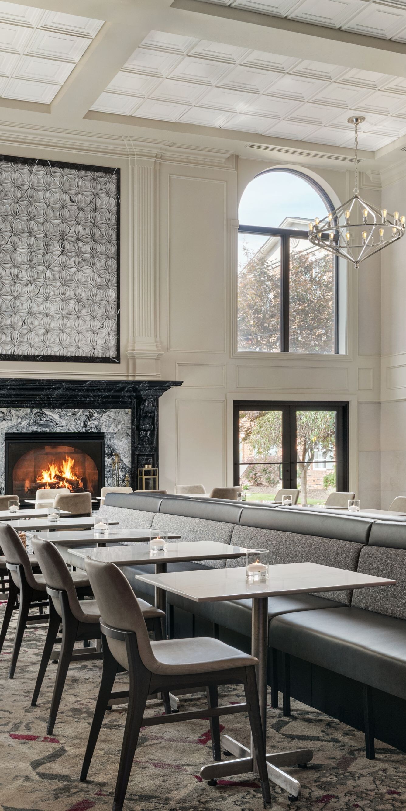 Lobby dining area with fireplace and seating