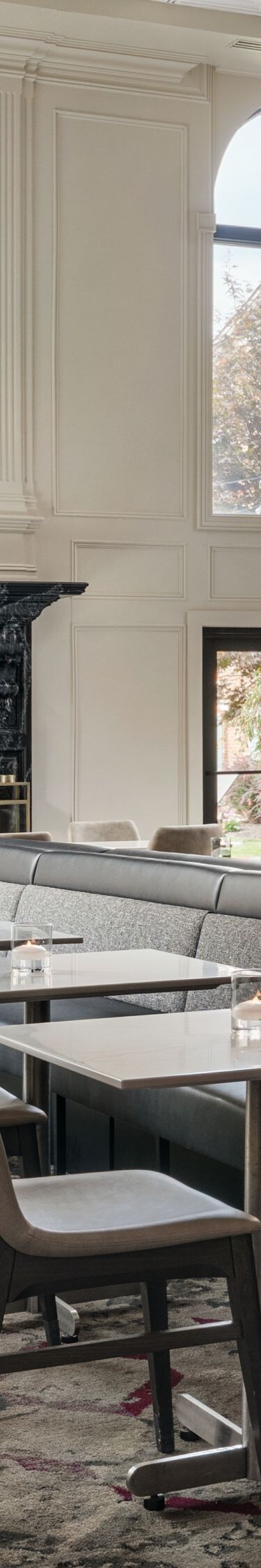 Lobby dining area with fireplace and seating