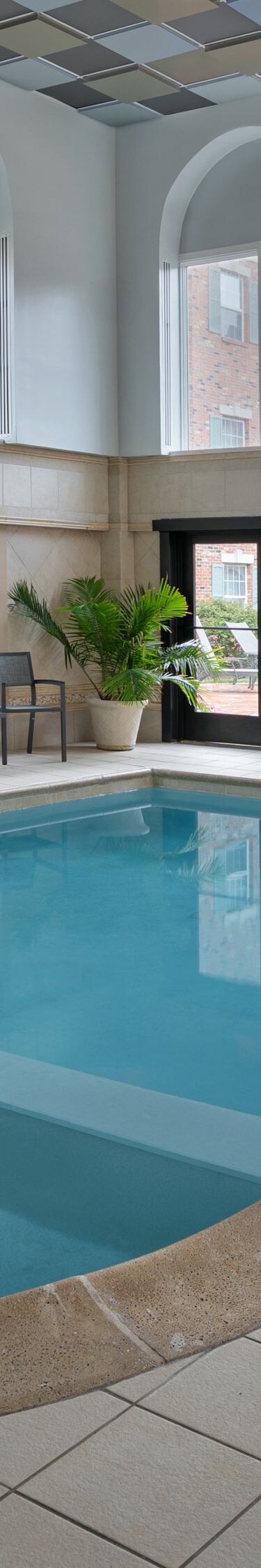Indoor pool with side seating on property