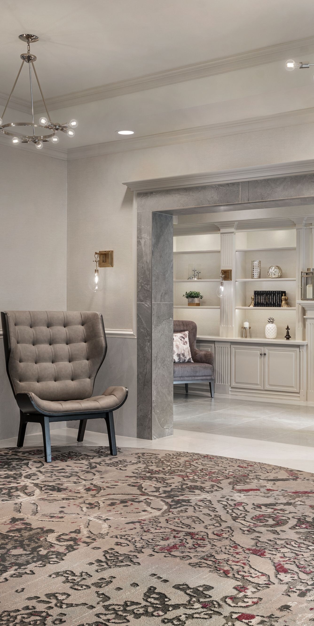 Lobby lounge with chairs, tables, and fireplace