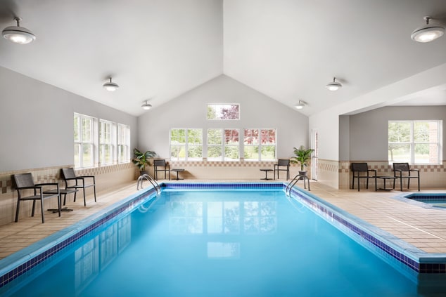 Indoor pool and hot tub with seating