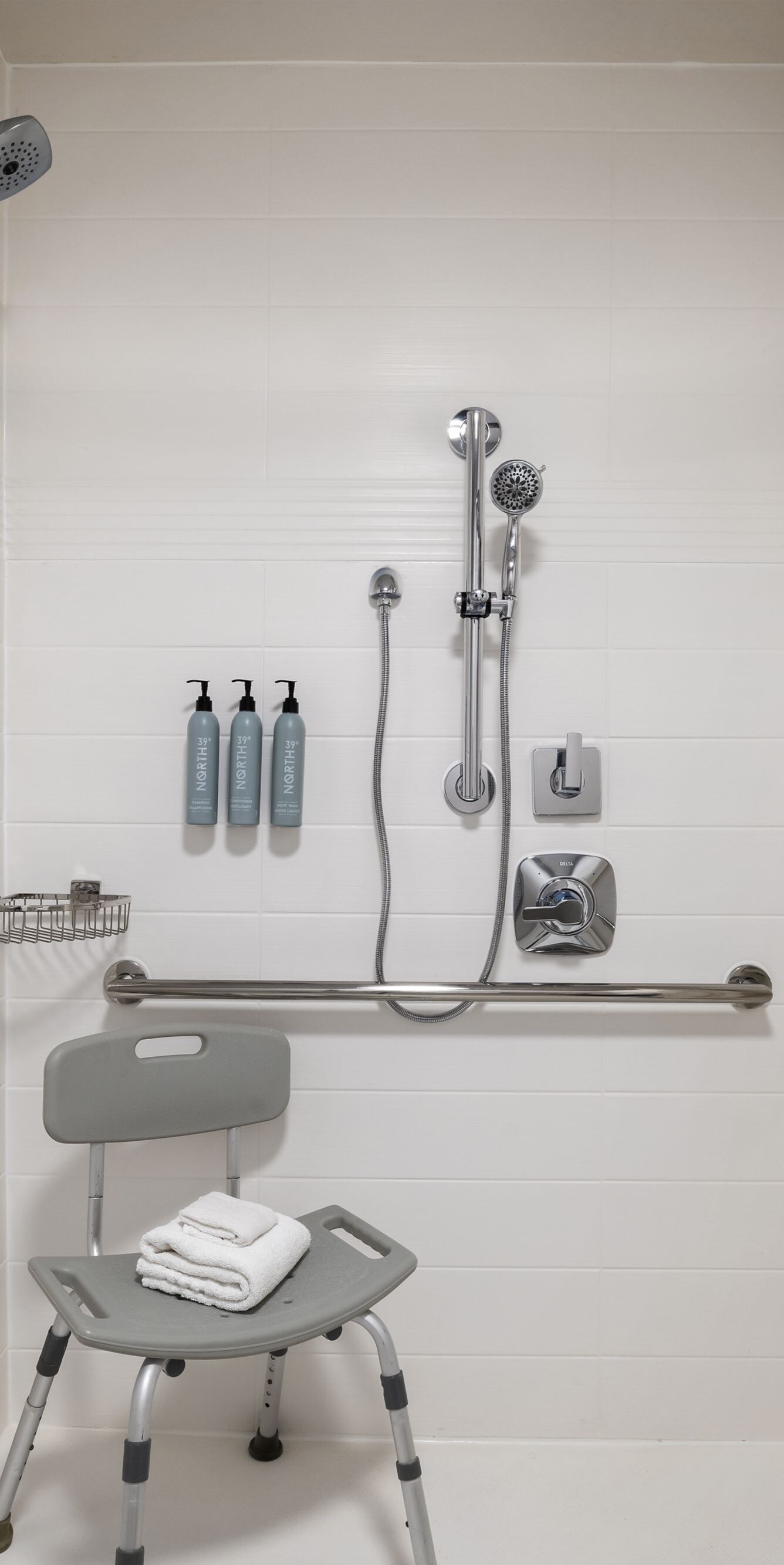 Accessible shower with seat and grab bars