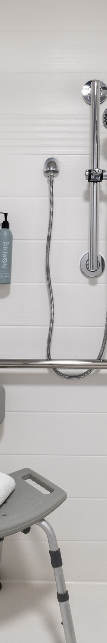 Accessible shower with seat and grab bars