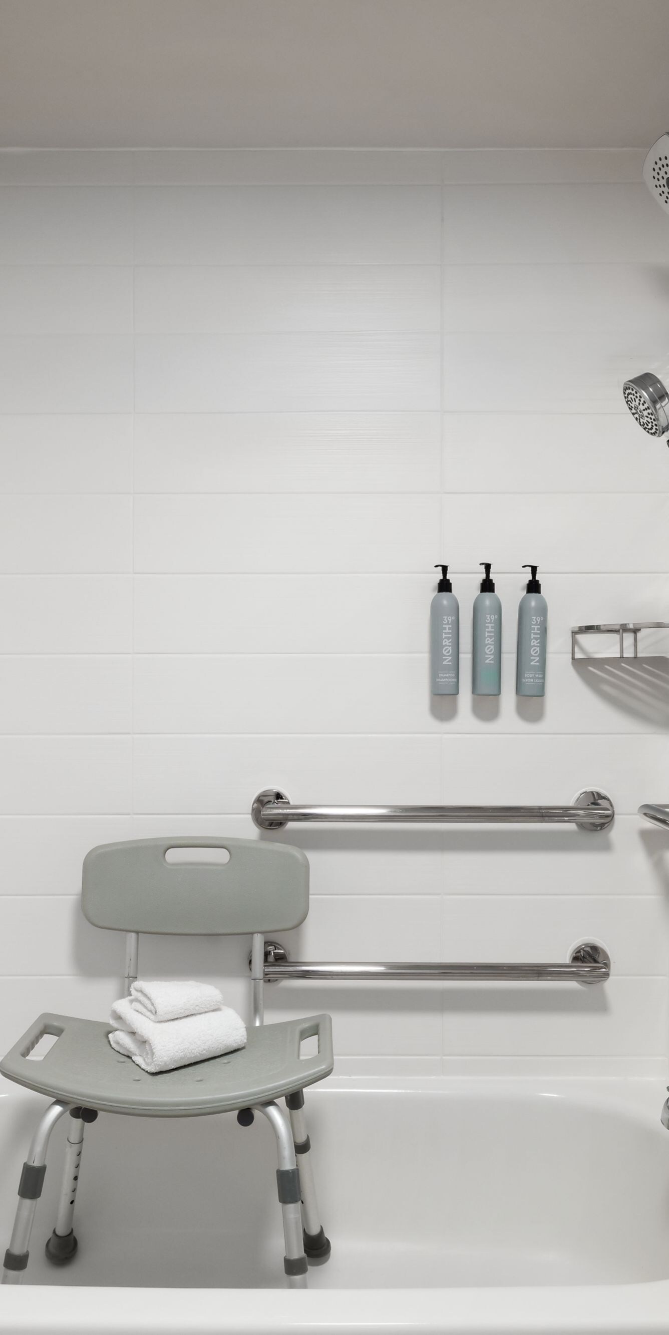 Accessible bathtub with seat and grab bars