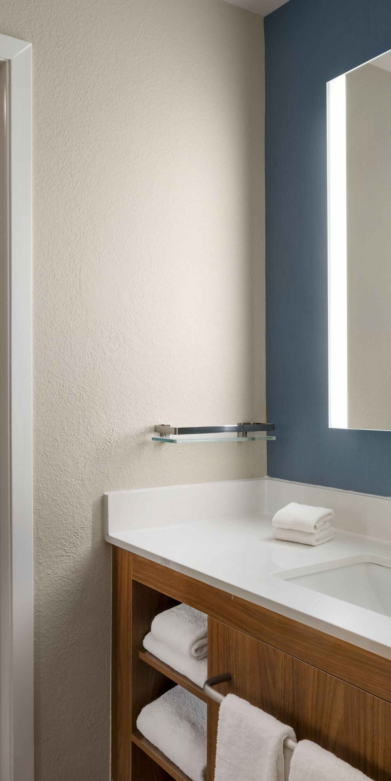 Bathroom with spacious vanity and walk-in shower