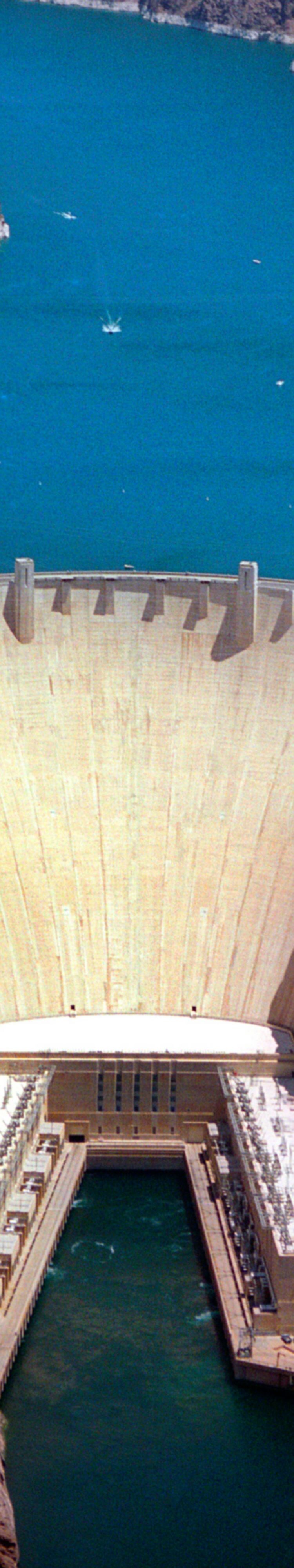 Hoover dam is an engineering wonder of the world. Formerly named Boulder Dam, this historic man-made creation tamed the mighty Colorado River and created North America's largest man-made lake, Lake Mead. The 726 feet high, arch-gravity dam is 660 feet th