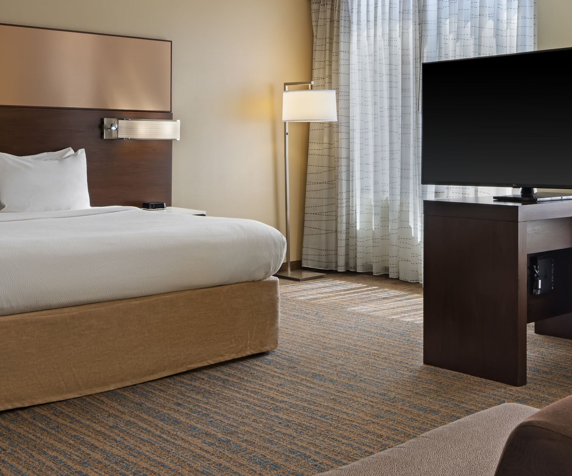 Studio with king bed and television