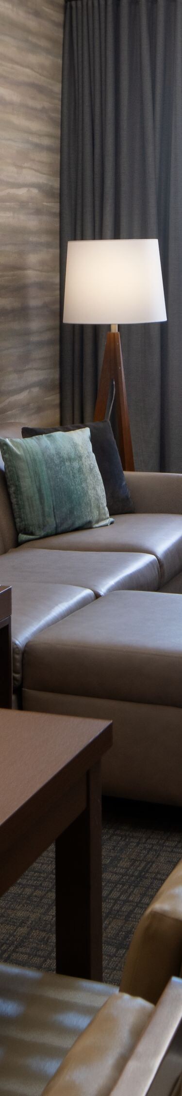 Suite living area with sofa and desk