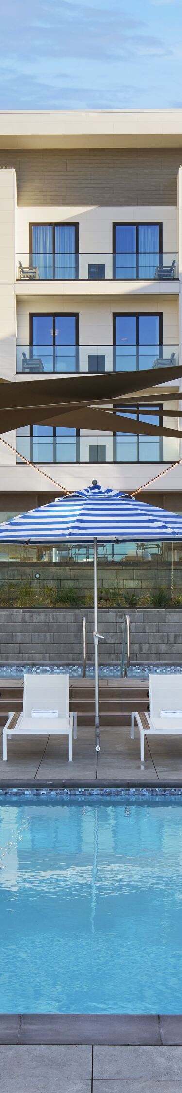 outdoor pool with lounge chairs