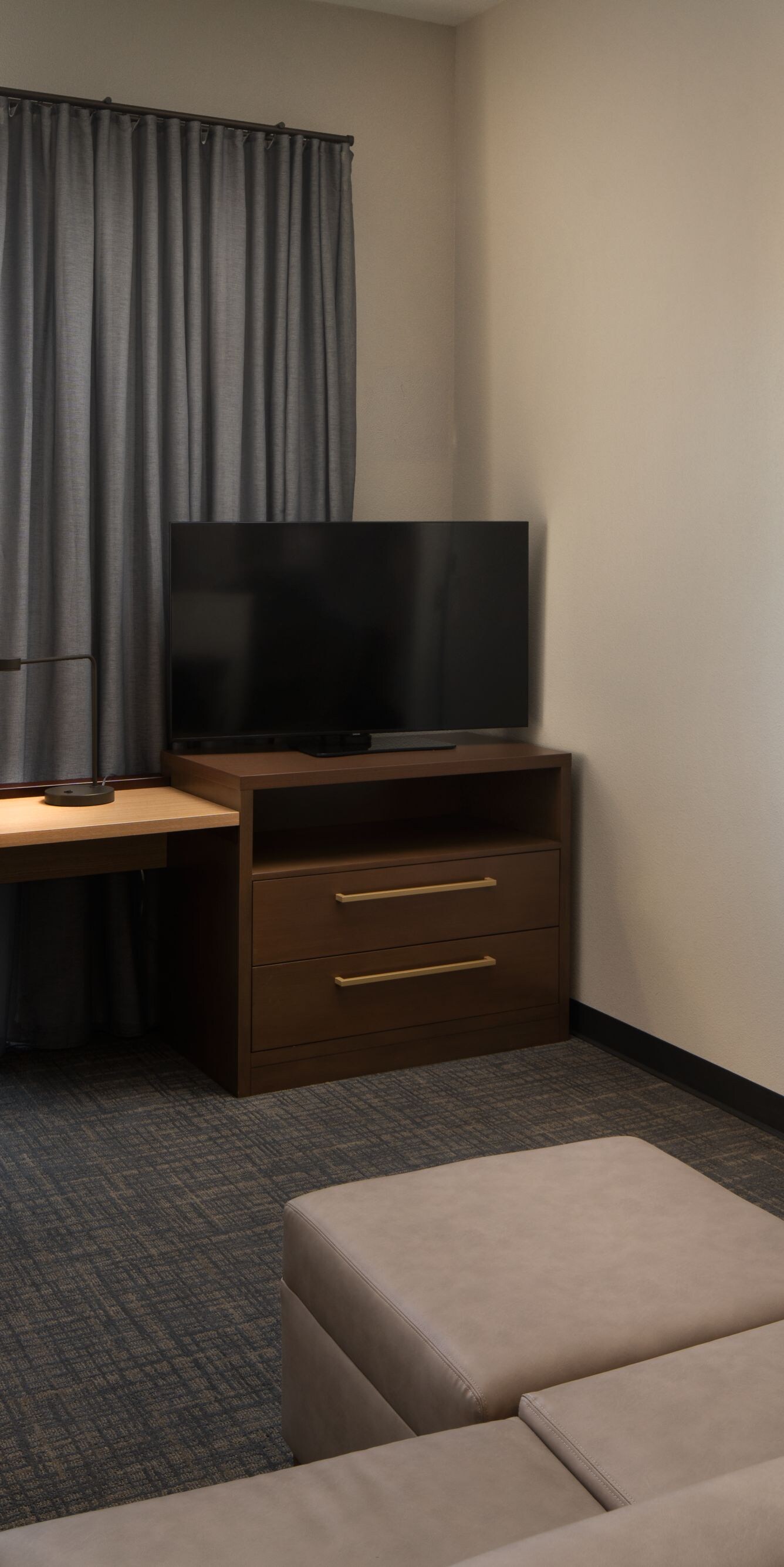 One-bedroom suite with living area and desk